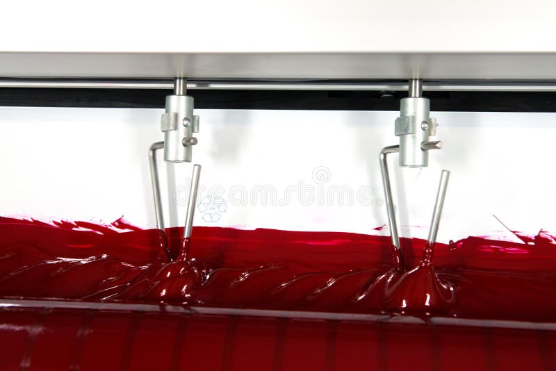 Press printing - Offset machine. Printing technique where the inked image is transferred from a plate to a rubber blanket, then to stock photography