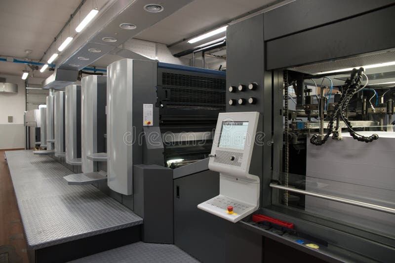 Press printing - Offset machine. Printing technique where the inked image is transferred from a plate to a rubber blanket, then to royalty free stock photo