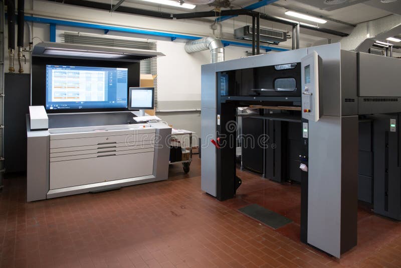 Press printing - Offset machine. Printing technique where the inked image is transferred from a plate to a rubber blanket, then to stock images