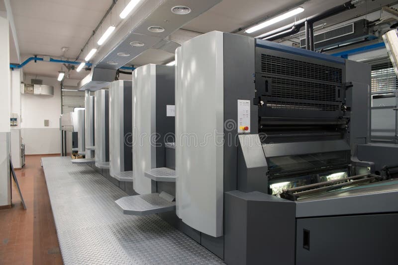 Press printing - Offset machine. Printing technique where the inked image is transferred from a plate to a rubber blanket, then to royalty free stock images