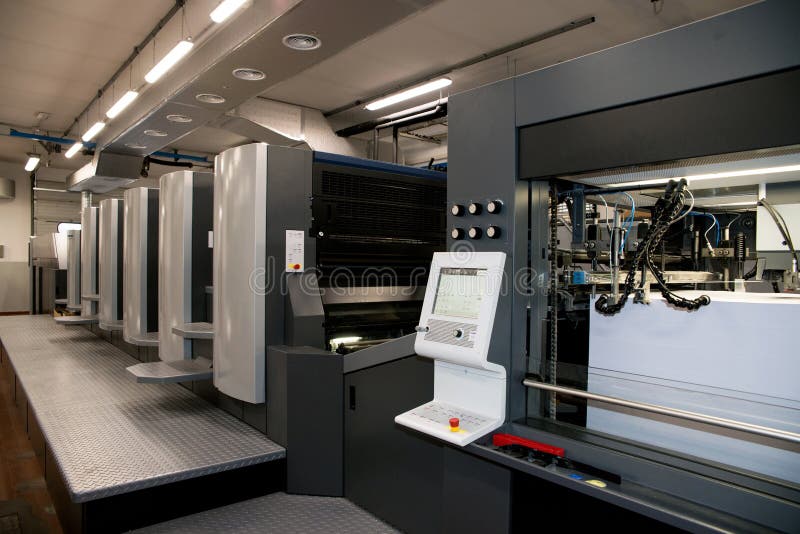 Press printing - Offset machine. Printing technique where the inked image is transferred from a plate to a rubber blanket, then to stock photography