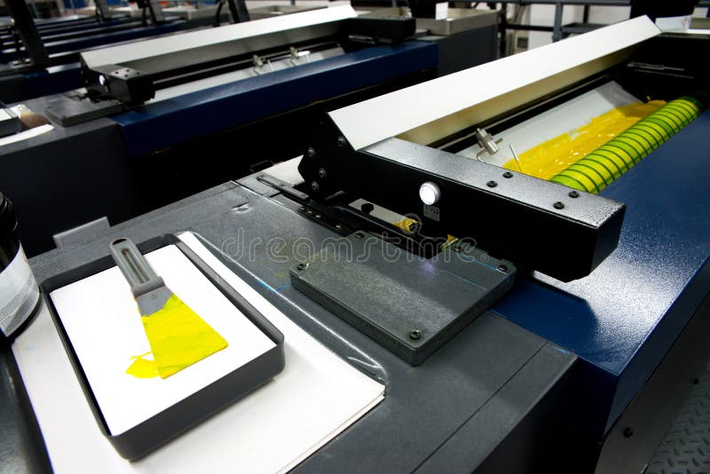 Press printing - Offset machine. Printing technique where the inked image is transferred from a plate to a rubber blanket, then to royalty free stock image