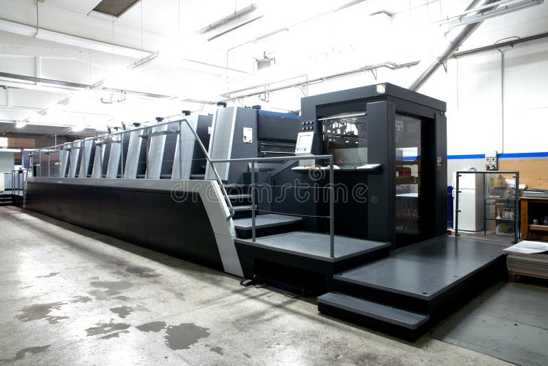 Press printing - Offset machine. Printing technique where the inked image is transferred from a plate to a rubber blanket, then to royalty free stock images