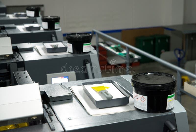 Press printing - Offset machine. Printing technique where the inked image is transferred from a plate to a rubber blanket, then to stock photo