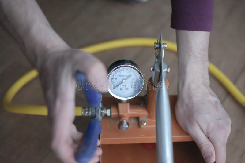 Pressure Tester Pump is in the Hands of a Worker Stock Photo Image of