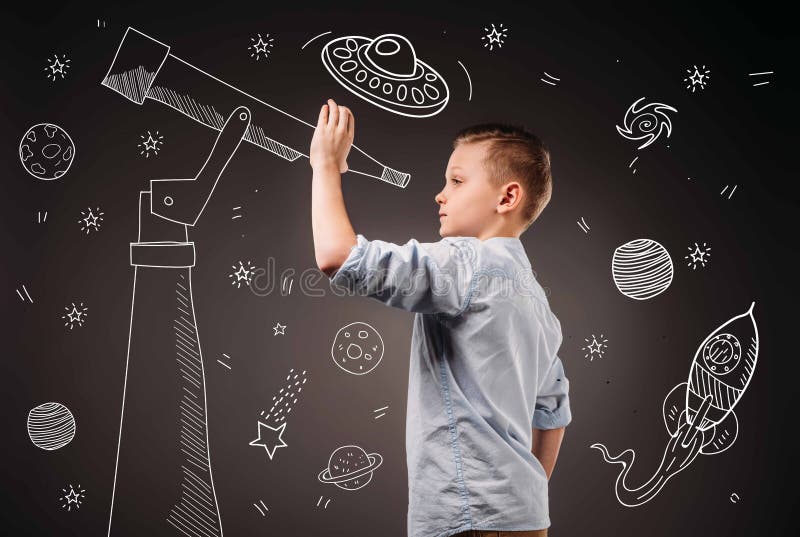 Preteen boy pretending to be a astronomer with drawn telescope and UFO, planets, spaceship