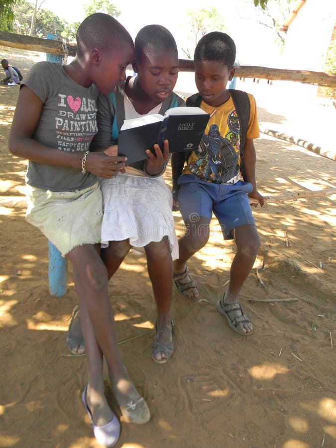 Two naked girls playing with one boy