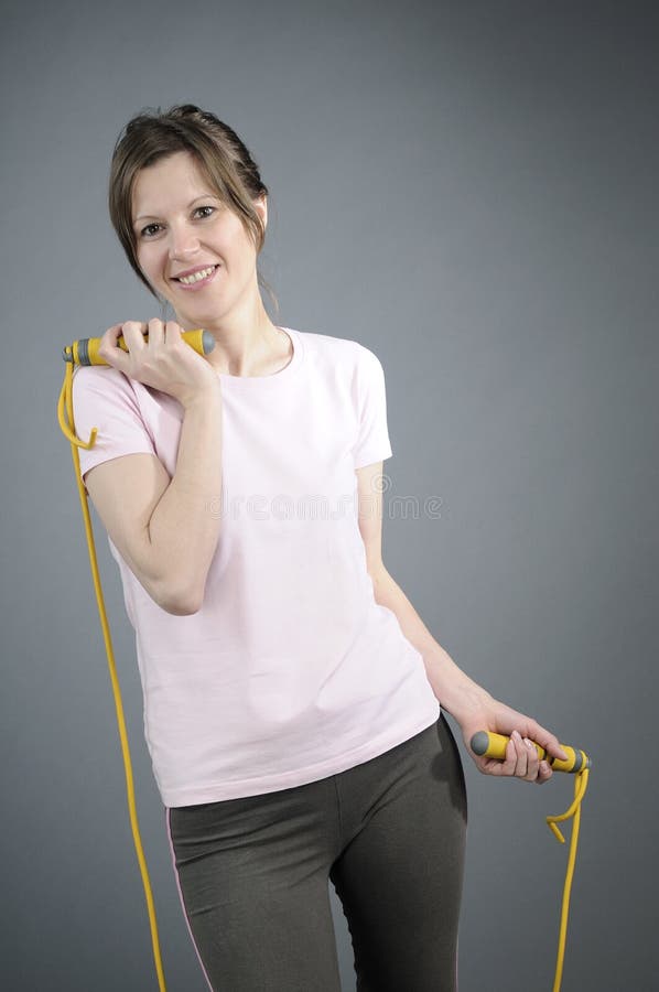 Pretty aerobics trainer exercising