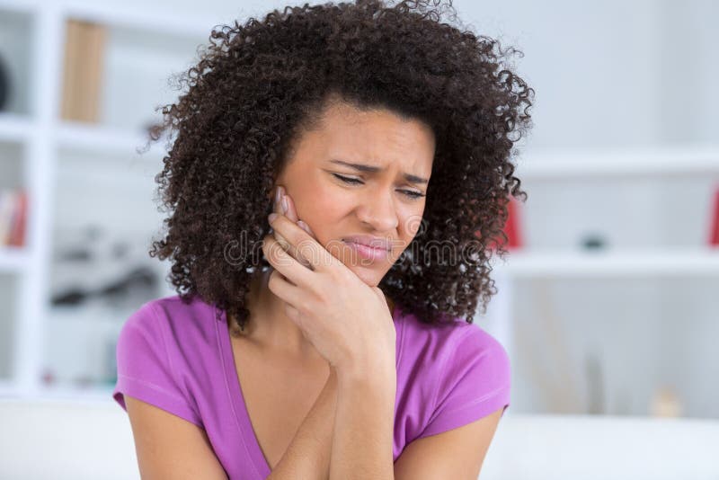 Pretty african american young woman have toothache stock photography Pretty african american young woman have toothache stock photography