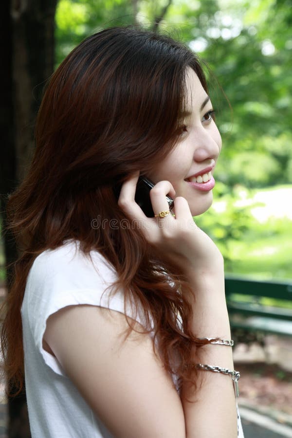 Pretty asia girl talking on the phone