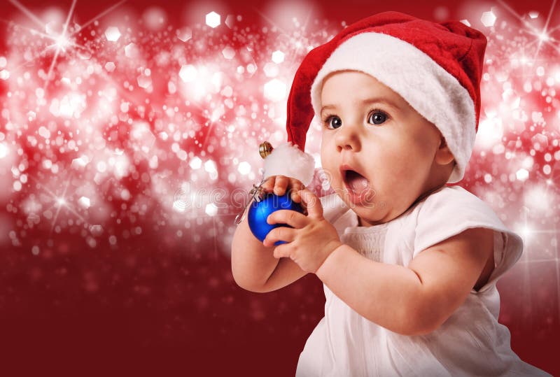 Pretty baby in christmas hat stock images