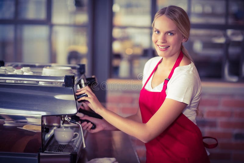 Pretty Barista Looking At Camera And Using The Coffee Machine Stock Photo Image of business