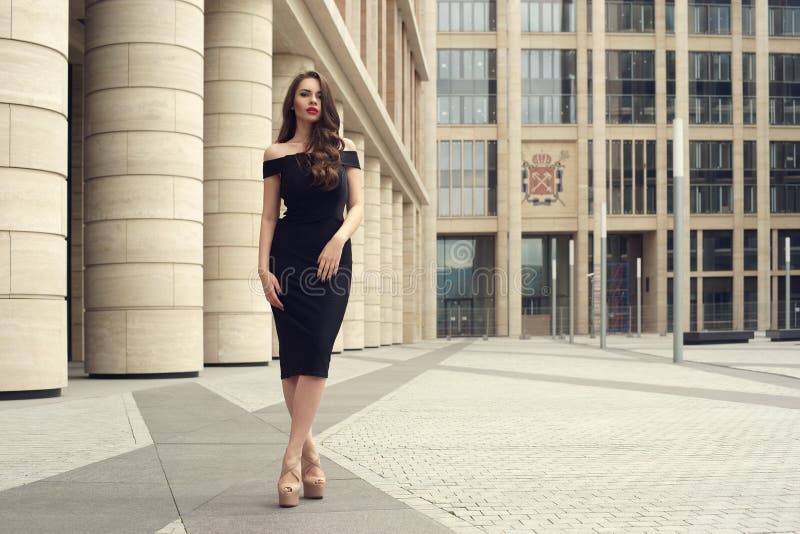 Pretty beautiful business woman in elegant black dress royalty free stock photography Pretty beautiful business woman in elegant black dress royalty free stock photography