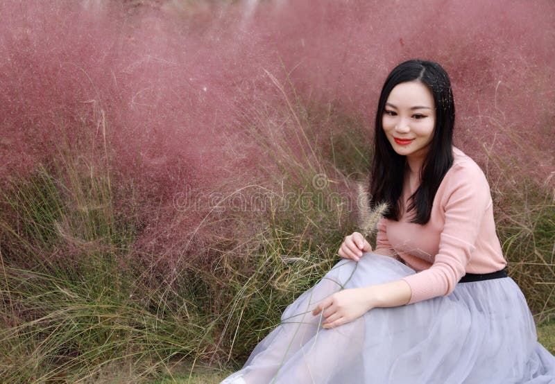 Pretty beautiful cute Asian Chinese woman girl feel freedom sweet dream pray flower field autumn fall park grass lawn hope nature royalty free stock images Pretty beautiful cute Asian Chinese woman girl feel freedom sweet dream pray flower field autumn fall park grass lawn hope nature royalty free stock images