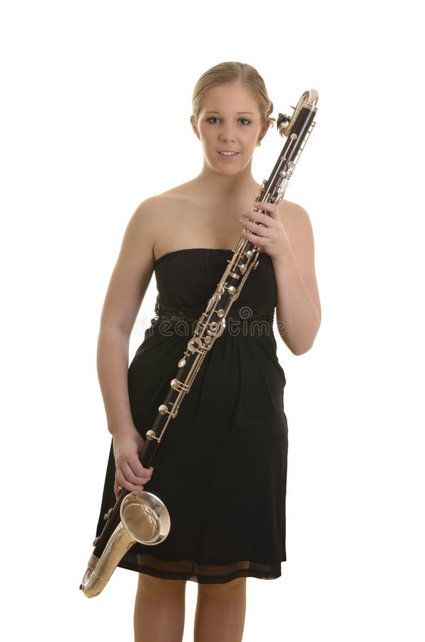 Pretty blonde woman in evening dress with bass clarinet royalty free stock photography Pretty blonde woman in evening dress with bass clarinet royalty free stock photography