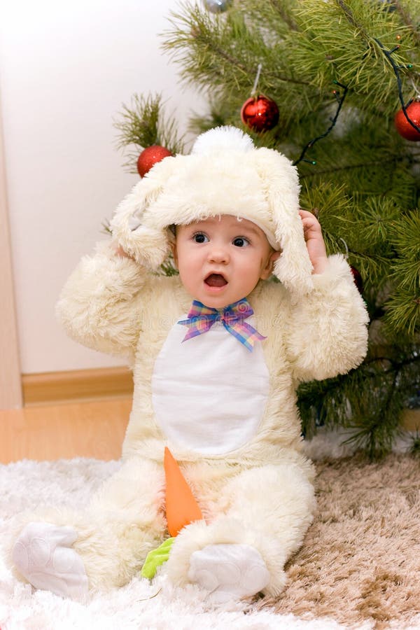 Pretty caucasian baby in rabbit costume