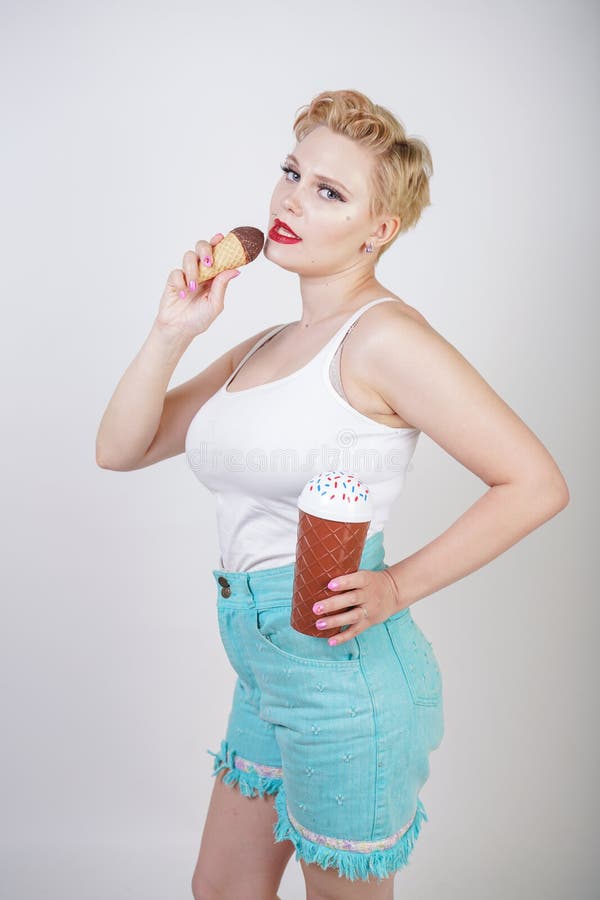 Pretty Caucasian Blonde Short Hair Girl Eating Tasty Ice Cream With