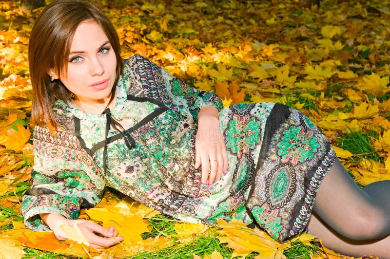 Pretty caucasian girl in autumn forest