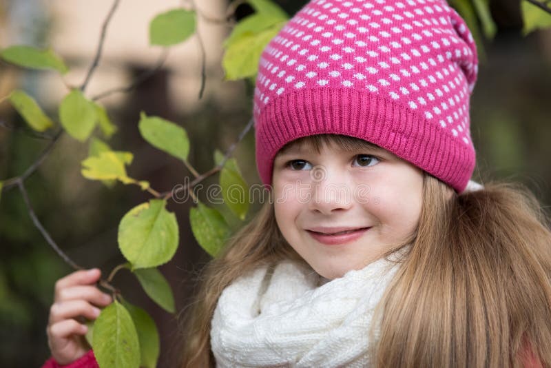 Pretty Child Girl Wearing Warm Winter Clothes Holding Tree Branch with ...