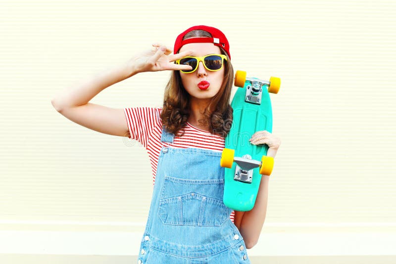 Pretty Cool Woman with Skateboard Having Fun Over White Stock Photo ...