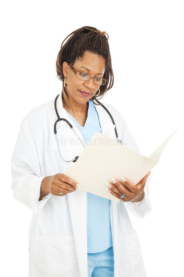 Pretty Doctor Reads Medical Chart stock photos Pretty Doctor Reads Medical Chart stock photos
