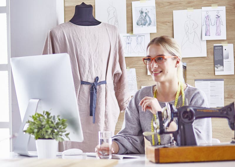 Pretty Dressmaker Showing a New Design To Her Client Stock Photo ...