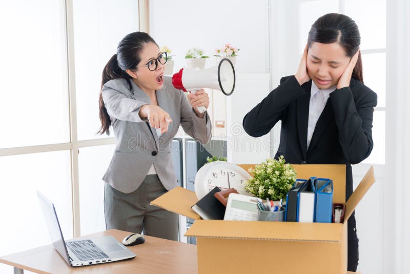 Pretty female boss speaking with business worker royalty free stock photography Pretty female boss speaking with business worker royalty free stock photography