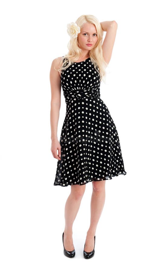 Pretty female in polker dot dress isolated