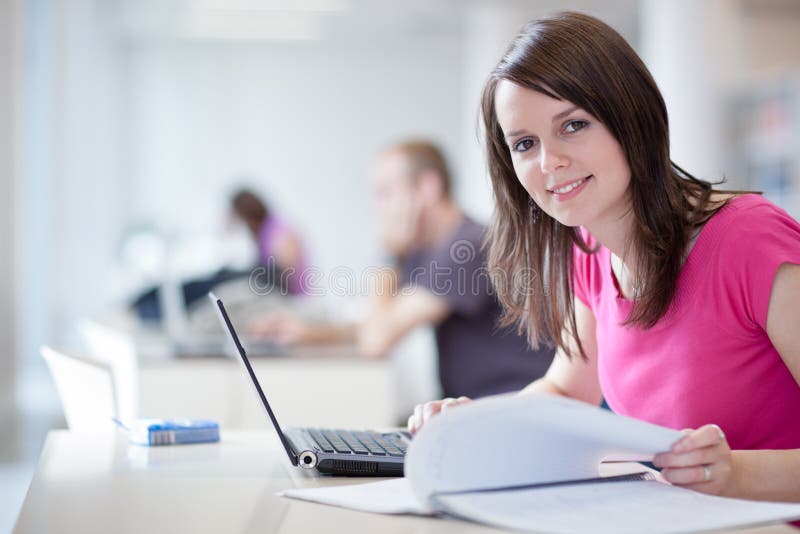 Pretty female student with laptop