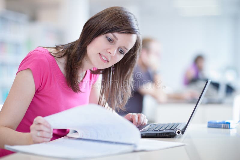 Pretty female student with laptop