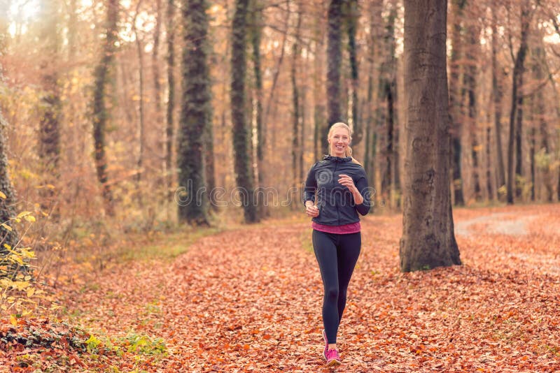 Pretty Fit Young Woman Jogging in Woodland Stock Image - Image of ...