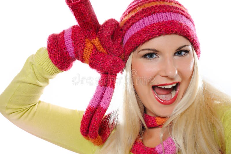 Pretty funny winter woman in hat and gloves