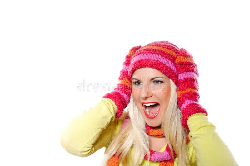 Pretty funny winter woman in hat and gloves scream