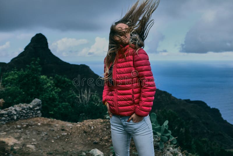 Pretty girl of background of mountain landscape royalty free stock image Pretty girl of background of mountain landscape royalty free stock image