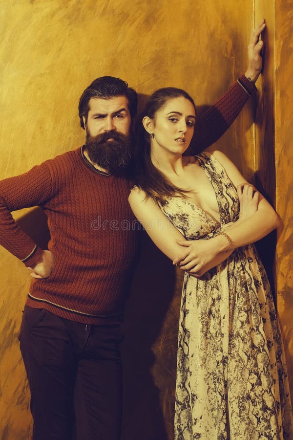 Pretty girl standing near bearded man with long beard stock images Pretty girl standing near bearded man with long beard stock images