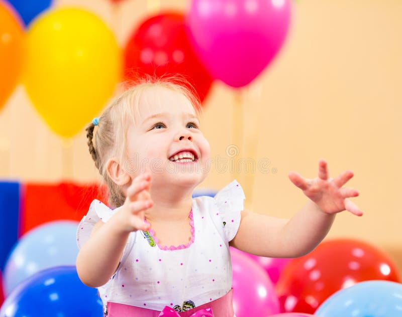 Little Girl Holding Balloons Stock Image - Image of pretty, contact ...