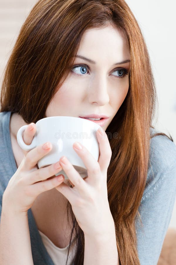 Pretty girl with cup of tea