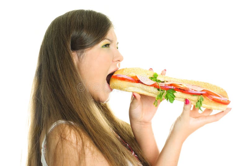 Pretty girl eating a big hamburger