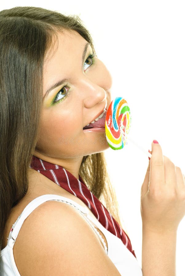 Pretty girl eating a candy stock photo. Image of hair 9168636