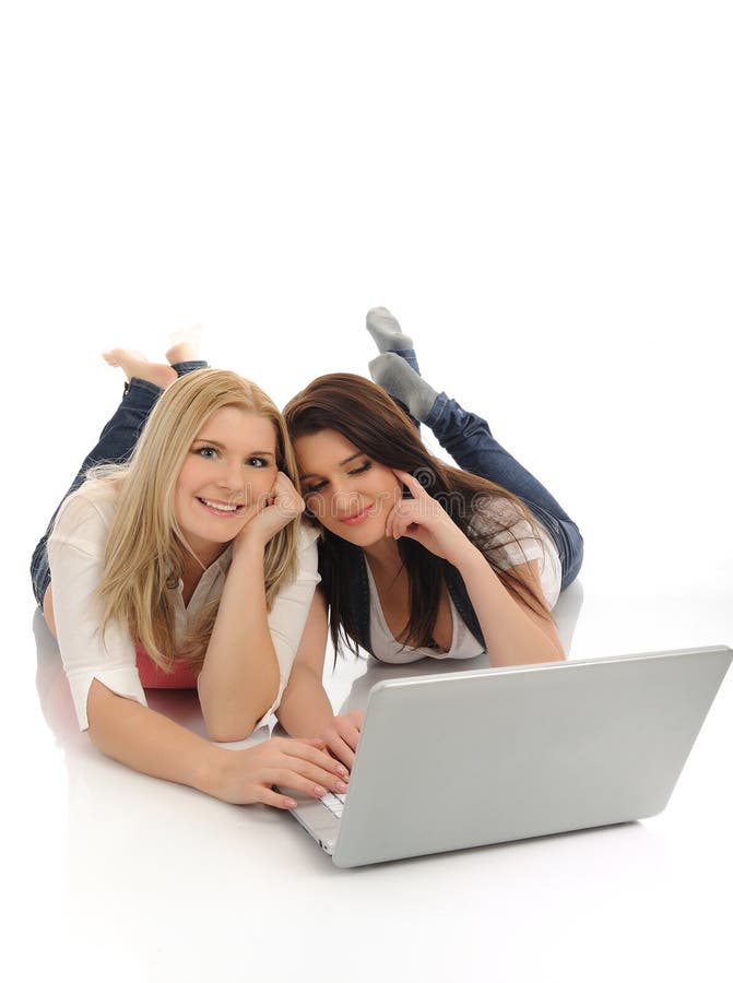 Pretty girl friends in internet on laptop computer