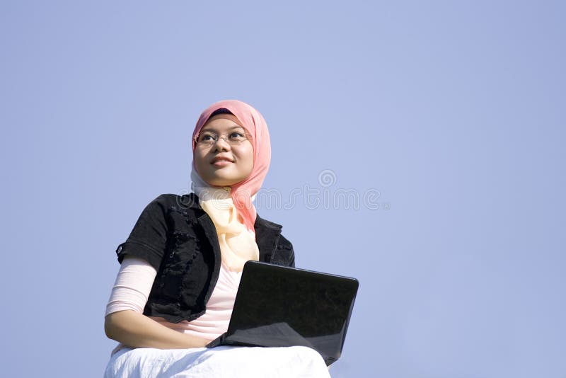 Pretty girl holding a laptop