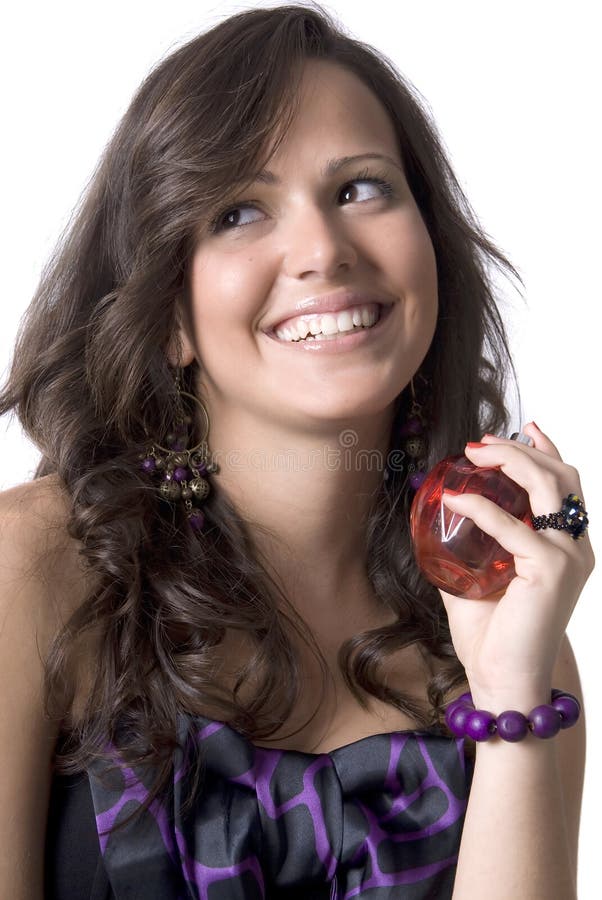 Pretty girl holding perfume