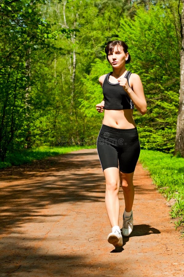 Pretty girl jogging stock photo. Image of person, grass 15012320