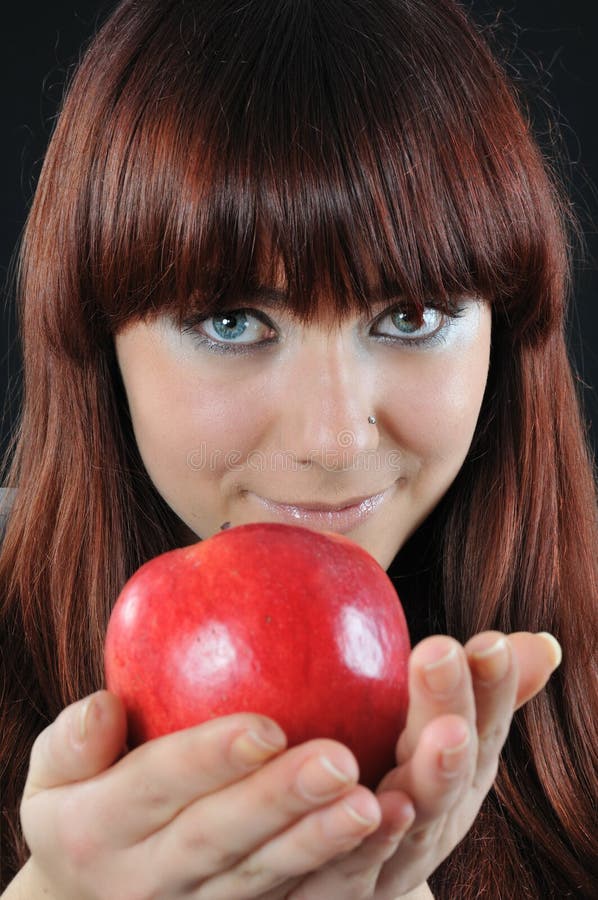 Pretty girl offer red apple