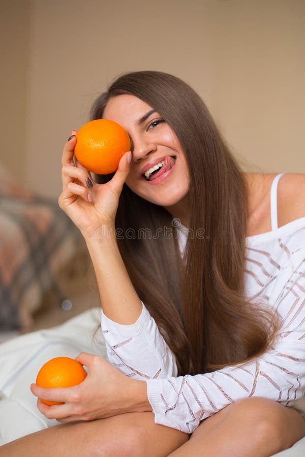Pretty girl with oranges stock photo. Image of funny 65689044