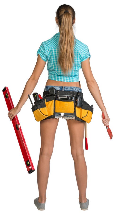 Pretty girl in shorts, shirt and tool belt with. 