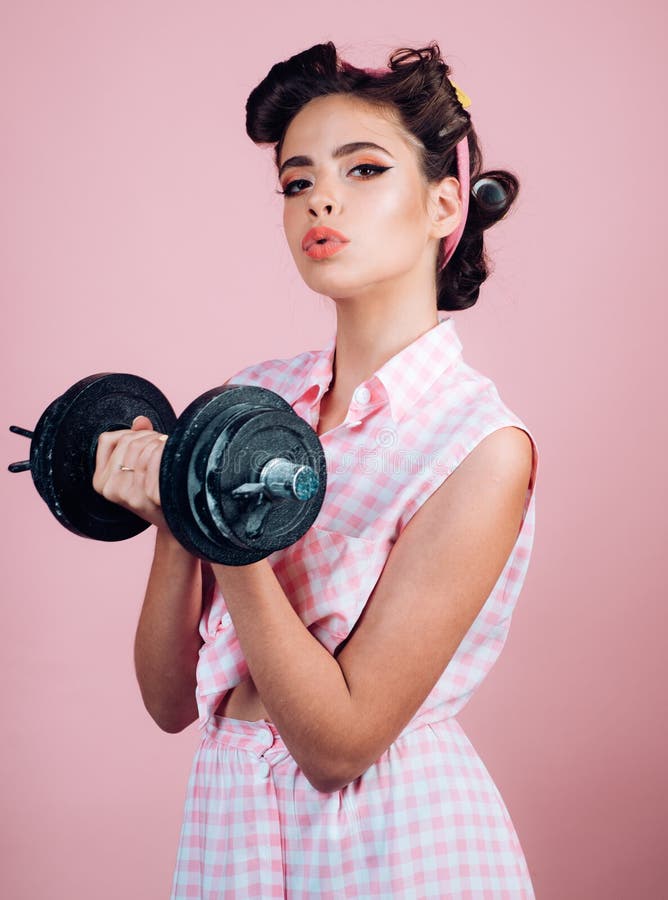 Pretty girl in vintage style. pinup girl with fashion hair. powerful housewife. pin up woman with trendy makeup. retro royalty free stock photography Pretty girl in vintage style. pinup girl with fashion hair. powerful housewife. pin up woman with trendy makeup. retro royalty free stock photography