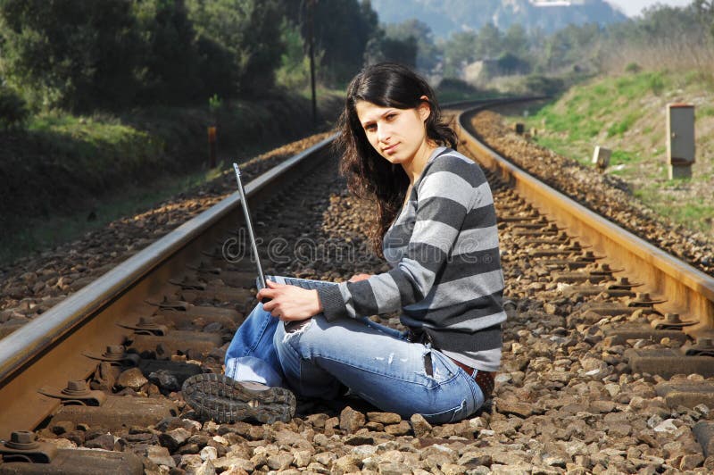 Pretty girl waiting for the train.