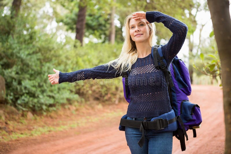 Pretty Hitchhiker Sticking Thumb Out on the Road Stock Photo Image of