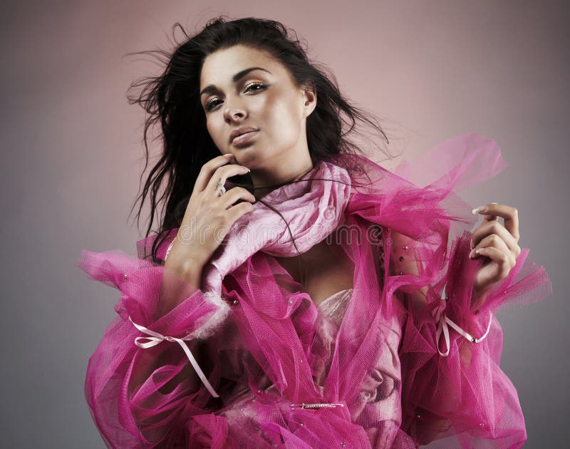 Pretty latina woman in pink dress portrait